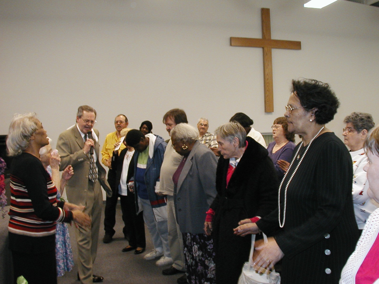 Reverend Glenn Cole ministers to his congregation in Cincinnati, OH